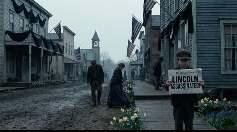 A newsboy carries word of Lincoln's assassination